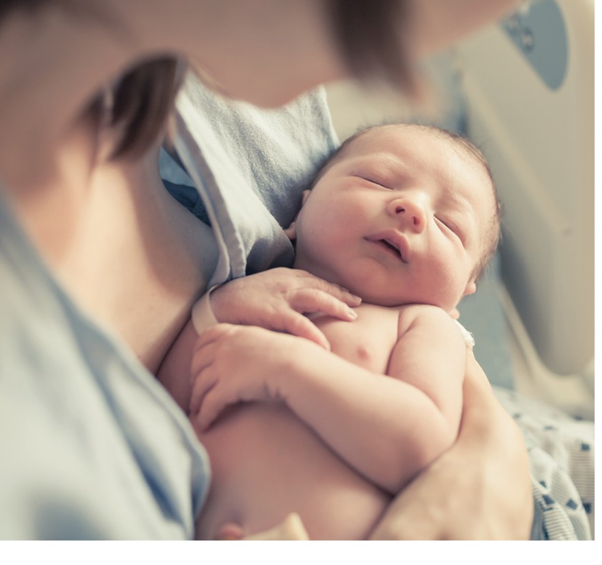 Newborn baby being held